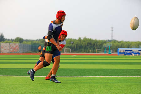 LUANNAN COUNTY, Hebei Province, China-August 23, 2020: rugby players train on the playgroundのeditorial素材