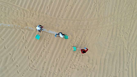 Farmers are turning and drying rice in the North China Plainの写真素材