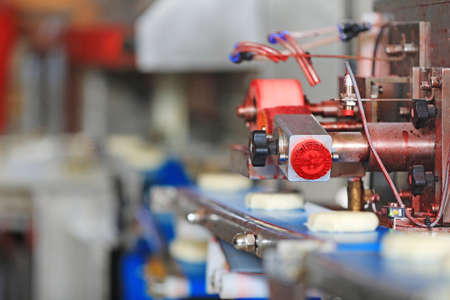 The running moon cake production line is in a food processing plant in North Chinaの写真素材