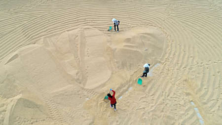 Farmers are turning and drying rice in the North China Plainの写真素材