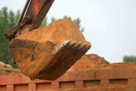 Excavator working, closeup of photo