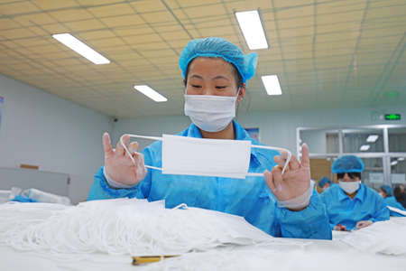 LUANNAN COUNTY, Hebei Province, China-April 23, 2020: Workers are busy on the production line in a...