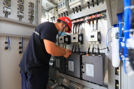 LUANNAN COUNTY, Hebei Province, China-July 10, 2020: workers work in a factory on a production lineのeditorial素材