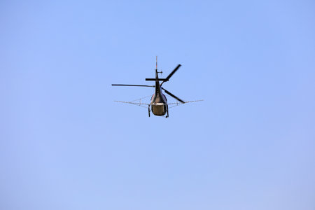 Agricultural helicopters for controlling Hyphantria cunea spray pesticides over the cityのeditorial素材