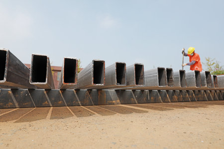LUANNAN COUNTY, Hebei Province, China-August 11, 2020: The workers are painting the steel beams in the open airのeditorial素材