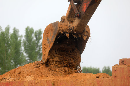 Excavator working, closeup of photoの写真素材