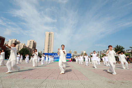 LUANNAN COUNTY, Hebei Province, China-August 8, 2020: People are practicing Taijiquan in the squareのeditorial素材