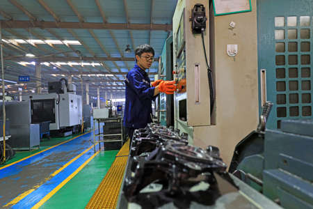 LUANNAN COUNTY, Hebei Province, China-September 29, 2020: Workers work hard on the production line of automobile safety systemのeditorial素材