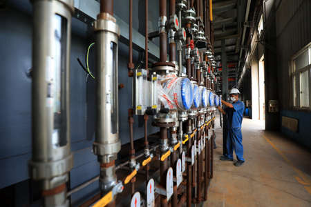 LUANNAN COUNTY, Hebei Province, China-July 10, 2020: workers work in a factory on a production lineのeditorial素材