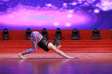 LUANNAN COUNTY, Hebei Province, China - January 1, 2020: Fitness project yoga performance on stage.のeditorial素材