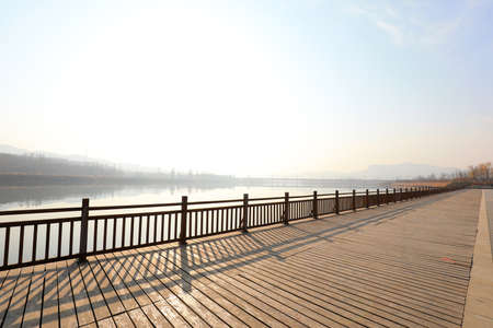 The wooden viewing platform is in the parkの写真素材