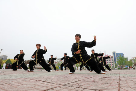 LUANNAN COUNTY, Hebei Province, China - April 29, 2019: people practice Taijiquan in the park square.のeditorial素材