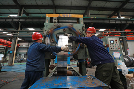 LUANNAN COUNTY, Hebei Province, China - March 26, 2020: Workers are busy on the strip production...