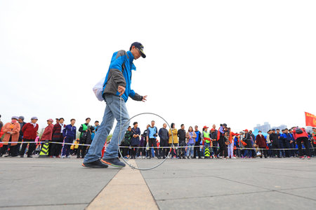 LUANNAN COUNTY, Hebei Province, China - April 20, 2019: Tourists take part in the circle pushing game competition at a fun sports meeting.のeditorial素材