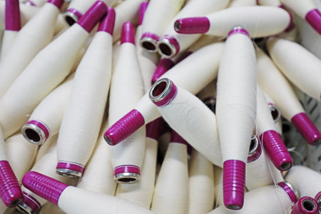 Cotton yarn is piled up in a spinning millの写真素材