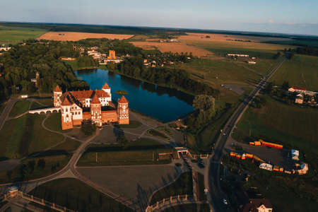 Mir castle with spires near the lake top view in Belarus near the city of Mir.