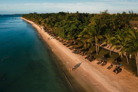 On the beautiful beach of the island of Mauritius along the coast. Shooting from a bird's eye view...