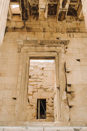 Ancient Greek ruins of Propylaea on a top of Acropolis hill in Athens. Acropolis - main tourist attraction of Athens. Greeceの写真素材
