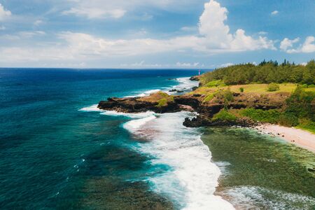View of the famous Golden beach between black volcanic rocks on the banks of the Gris-Gris river, La Roche qui pleure in Mauritiusの写真素材