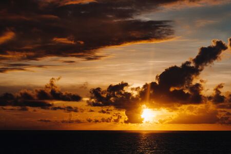 a fabulous view of the sunset in Mauritius. clouds against the setting sun.の写真素材