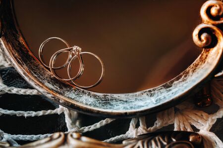 Close-up of two wedding gold rings engagement ring.Three rings.Wedding ring.Wedding.の写真素材