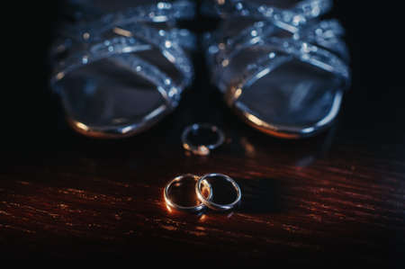 Close-up of two gold wedding rings in a black background.Wedding ring.Wedding rings