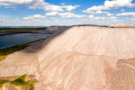 Mountains of products for the production of potash salt. Salt mountains near the city of Soligorsk. Production of fertilizer for the land. Belarusの写真素材