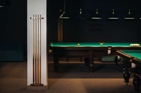 Billiard cue in the game club. Billiard club.