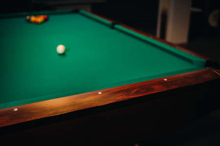 decorative billiard hole and green table with balls in the billiard club.の写真素材