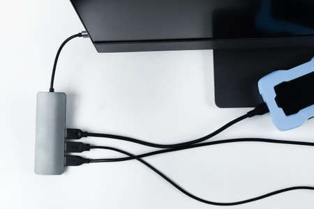 Adapter with connection of external hard drives connected to a monoblock on a white...
