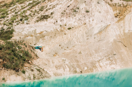 Vaukavysk chalk pits or Belarusian Maldives are beautiful saturated blue lakes.Two tourists pull a...