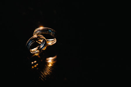 Close-up of two gold wedding rings for a wedding.の写真素材