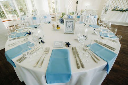 wedding table decoration with blue flowers on the table in the restaurant table decor for dinner at...