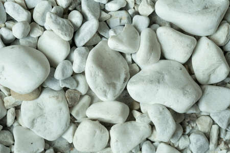 close-up of few white stones, front view.