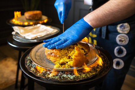 Shah's pilaf. Serving and cutting Khan's pilaf in lavash in Azerbaijani style in the restaurant. Traditional Oriental dish.の写真素材