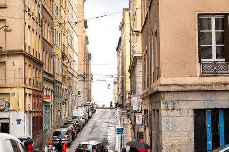 LYON, FRANCE, APRIL 7, 2019: People walk along a narrow street in the historic center of Lyon, France.のeditorial素材