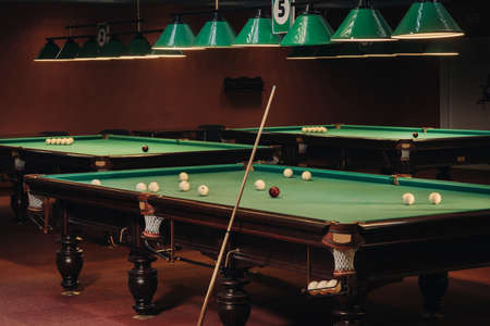 Billiard table with green surface and balls in the billiard club.Pool Game.の写真素材