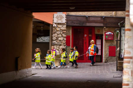 Sirmione, Italy-October 9, 2018: children march in formation in the town of Sirmione near Scaligera Castle.のeditorial素材