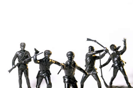 Vintage toy black soldiers isolated on white background.