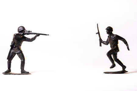 Vintage toy black soldiers isolated on white background.