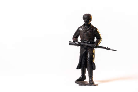 Vintage toy black soldier isolated on white background.