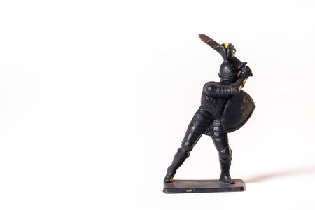 Vintage toys black soldier knight isolated on white background.