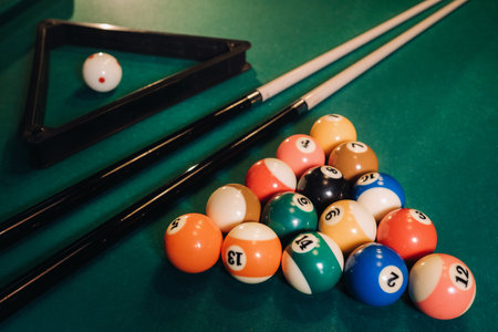 Billiard table with green surface and balls in the billiard club.Pool Game.の写真素材