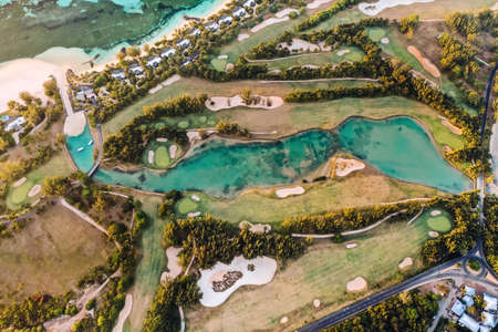 View from the height of the island of Mauritius in the Indian Ocean and the golf course on the Le Morne peninsula.の写真素材