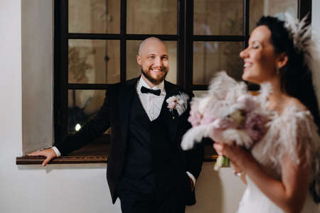 Elegant wedding couple in the interior of the old castle in the city of Nesvizh.の写真素材