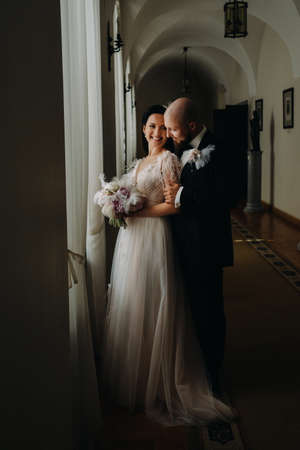 Elegant wedding couple in the interior of the old castle in the city of Nesvizh.の写真素材
