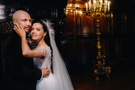 Elegant wedding couple in the interior of the old castle in the city of Nesvizh.の写真素材
