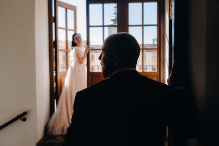 Elegant wedding couple on the balcony of an old castle in the city of Nesvizh.の写真素材