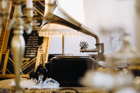 An old retro gramophone is playing a record.の写真素材