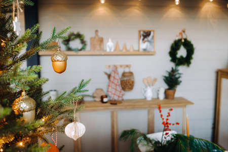 Close-up of a decorated Christmas tree with decorations in the interior of the Christmas kitchen.の写真素材
